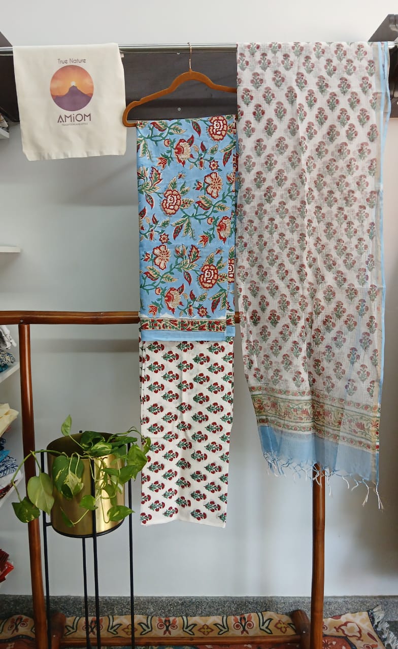 Handloom fabric sets displayed in AMIOM True Nature shop