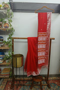 Red Shawl — Wooden Shelf with Plants